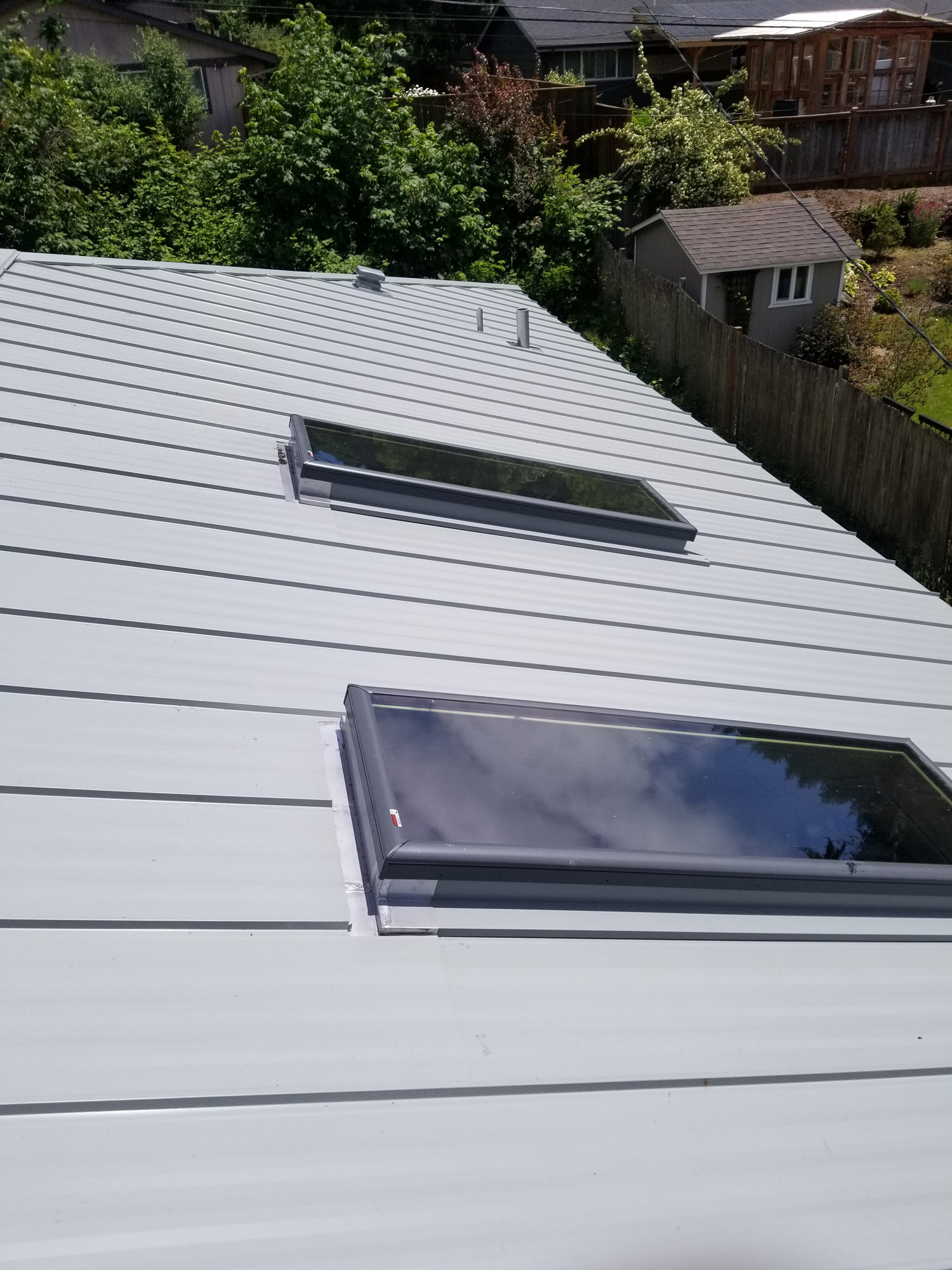 Gray metal roof with skylights